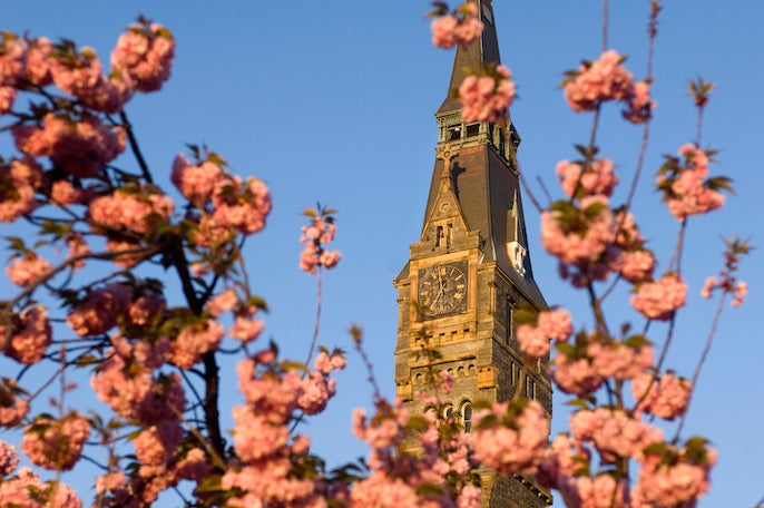 healy hall with blue skies anc clouds behind